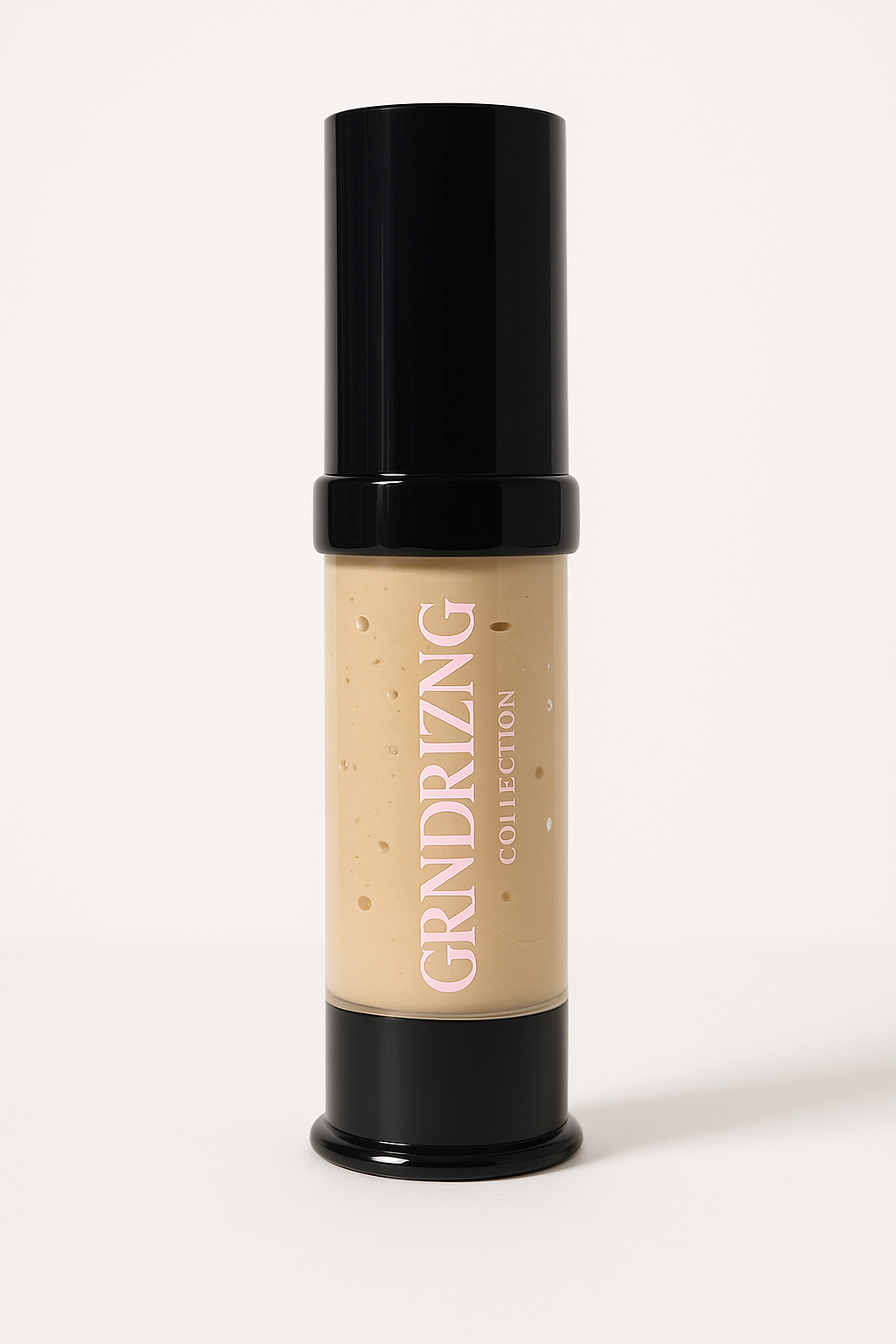 Liquid bronzer bottle with black cap and beige body on a white background