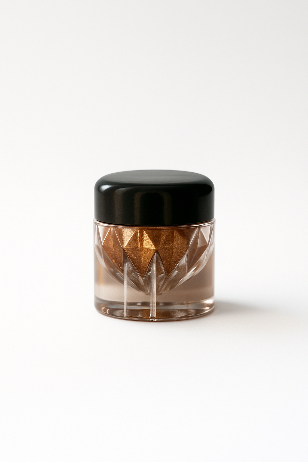 Clear jar with geometric design and black lid on a white background