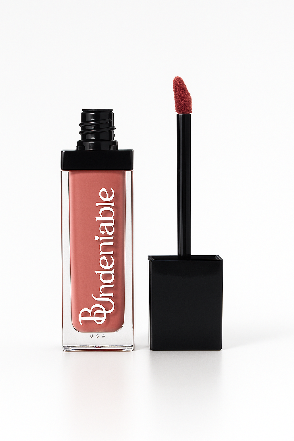 Pink lip gloss with applicator on a white background