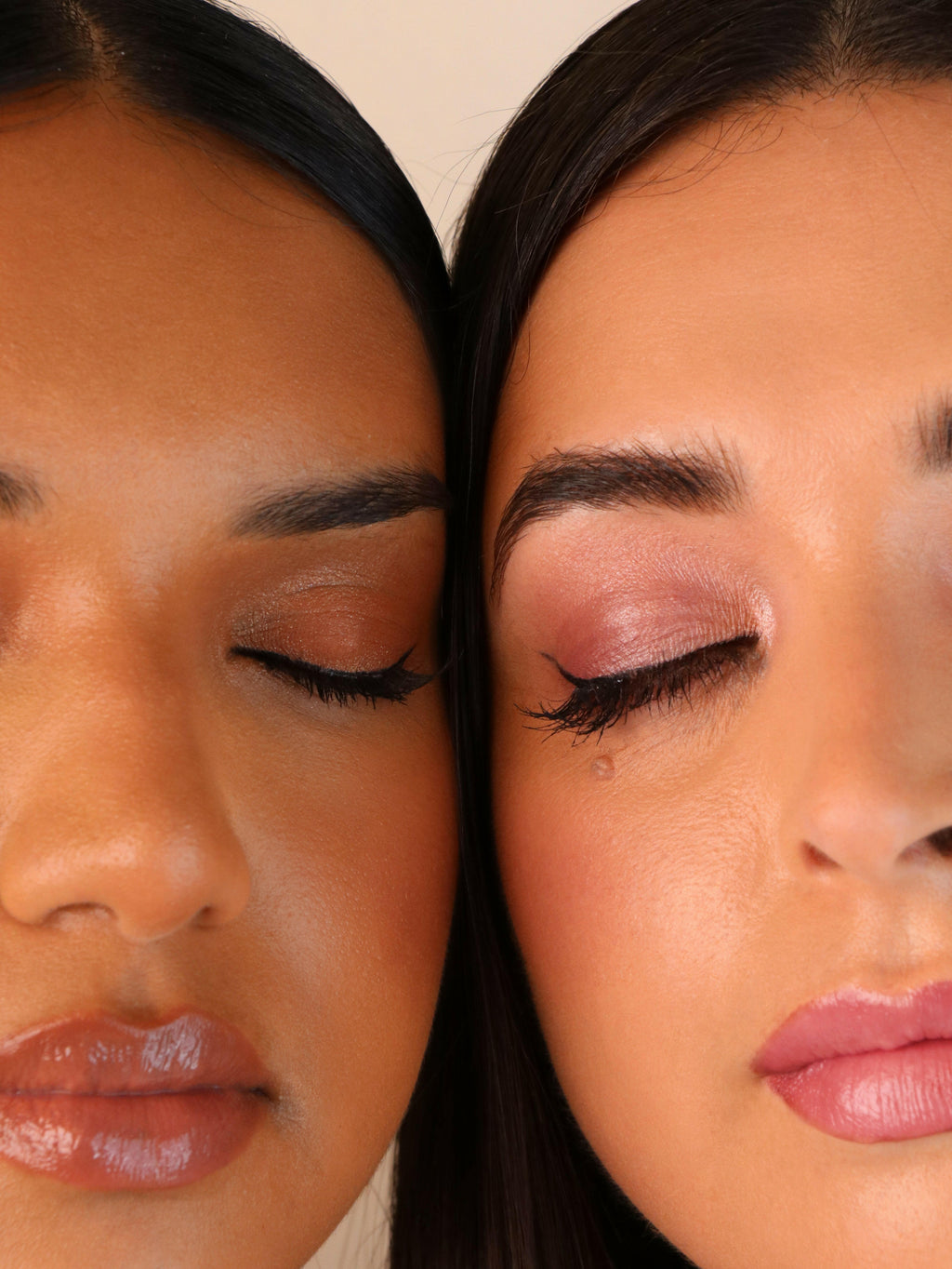 Close-up of two women with makeup on their faces