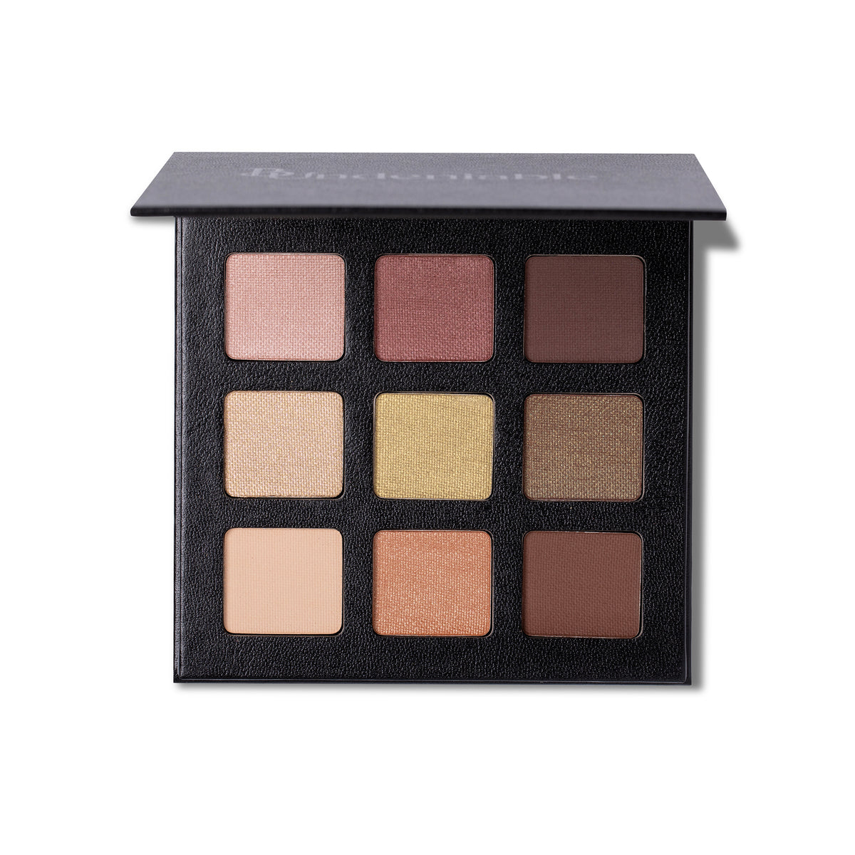 A 9-shade eyeshadow palette by B:Undeniable Natural, shown open against a white background. The palette features a textured black lid and a black base containing nine square pans in various neutral and warm shades, including pinks, browns, beiges, and golds.
