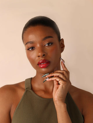 Woman wearing red lipstick with a neutral background